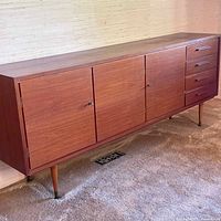 Front and side view of teak buffet showing overall design, wood tone, and tapered legs