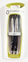 Packaged Franklin Covey rollerball pen and pencil set in blister pack with brand logo