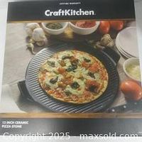 Box of Craft Kitchen pizza stone showing prepared pizza on stone.