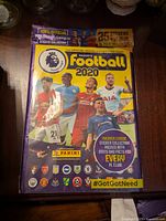 Front cover of the 2020 Panini Premier League football sticker album showing top players and official logos.