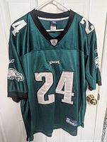 Front view of green Philadelphia Eagles football jersey number 24 with Reebok and NFL logos.