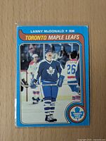 Front of Lanny McDonald hockey card showing player in Maple Leafs uniform
