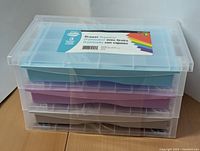 Front and top view of new three-drawer storage box showing transparent case and colored drawers with label.