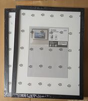 Two new black IKEA RIBBA picture frames, sealed, showing the front with size label 41x41 cm.