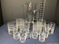 14-piece set showcasing 6 Mikasa Cheers whiskey glasses, 6 Duiske shot glasses, and 1 Krosno bubble base pitcher presented together
