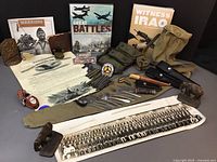 Overview of lot showing books, canvas gear, flatware, trims and patches