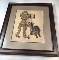 Full view of framed vintage nursery print showing the overall artwork, frame and mat, detailing the dog, pussycat, decorative chair and two mice.