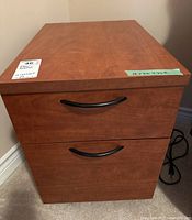 Front view of the 2-drawer file cabinet showing both drawers and black handles.