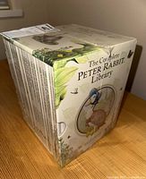 View of boxed set featuring 'The Complete Peter Rabbit Library' title with Peter Rabbit illustration on side and flap.