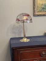 Full side view of the Partylite mosaic glass candle lamp showing the detailed mosaic pattern on the shade and metal stem and base.