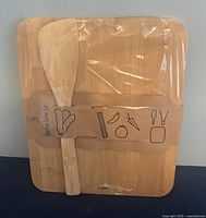 Bamboo cutting board and bamboo spatula in original packaging