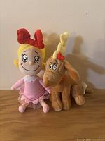 Photo of plush Cindy Lou Who and Bumble characters showing their size and condition