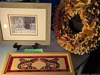 The three items together: framed wolf picture, wooden art box, and wooden flower wreath