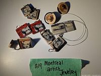 All jewelry items arranged on a white surface with green note indicating Montreal artist jewelry