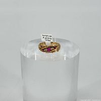 Front view of ring on clear display stand
