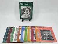 Approximately 12 North South Trader magazines displayed in a row with various colored covers showing different Civil War images.