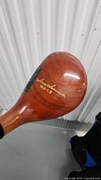 Close-up of vintage HONMA BIG-LB wooden golf club head showing brand and model