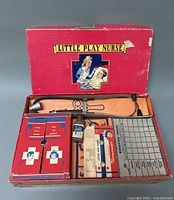The entire Little Play Nurse set in original box, showing unopened toy first aid cabinet, stethoscope, candy pill bottle, medical charts and accessories