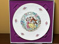 Top view of the 1979 Royal Doulton Valentines Day plate in original purple velvet-lined box.