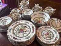 Overhead view of entire dinnerware set arranged on table