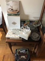 Overall view of the glassware and kitchen items arranged on wooden table