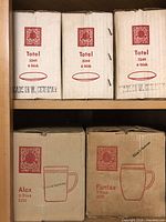 Shelves with Schott & Gen Mainz branded cardboard boxes for Totel 3244 and Fantax 3205 glass items marked 'Made in W. Germany'.