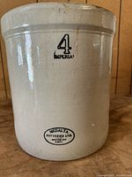 Front view of 4 gallon crock showing '4 Imperial' marking and Medalta Potteries Ltd. logo stamped on the side.