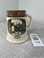 Front left angle showing Oliver asking for more scene and decorative border