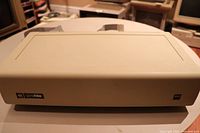 Front view of beige enclosure with rainbow Apple logo and proFile label