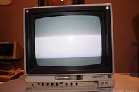 Front view of powered-on CRT screen showing moire banding