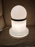 Lamp illuminated on textured fabric background