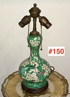 Full view of lamp showing double-gourd base and brass triple socket head