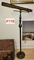 Full view of brass telescope on floor lamp stand