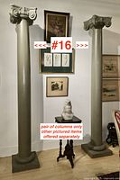 Two tall grey-painted architectural columns in room