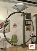 Front view of full circular hoop swing chair with diamond-shaped topper