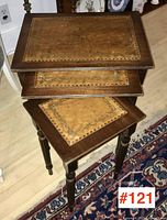Three nesting tables stacked inside each other showing full set