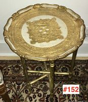 Side view of Florentine tray on folding table base on patterned rug