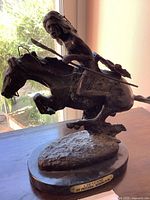 Front-side view of sculpture showing warrior on horseback and front plaque