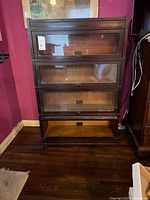 Front view of assembled four-section Globe-Wernicke sectional bookcase with glass doors