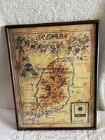 Full view of the framed colorful vintage map of Grenada showing the entire island and surrounding area, top floral border visible.