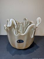 Front view showing the shape, color gradient, and sticker of the Murano glass bowl.