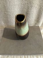 Top-down angled photo showing oval opening and green to brown gradient glaze on vintage West Germany vase.