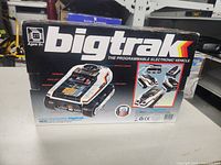 Front of Bigtrak box showing the vehicle and branding