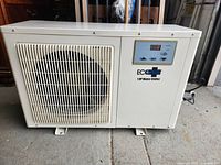 Front view showing fan intake grill and digital control panel