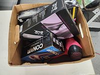 Boxed and loose hair care accessories including new in box and used stylers and dryers.