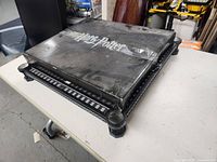 Closed Harry Potter branded Wizards Chess board box showing wear and dust