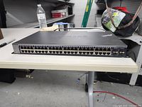Front view of Netgear ProSAFE GS748T switch showing 48 Ethernet ports and 4 combo SFP ports.