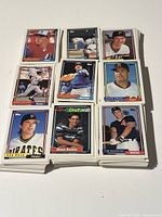 Photo of stacks of 1992 Topps baseball cards showing player images and card design.