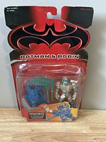 Front view of the Frostbite action figure in original Kenner 1997 Batman & Robin packaging, sealed in blister card.