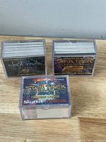 3 boxes of Star Trek trading cards including 1994 Edition, Special Edition, and Space Nine sets in plastic storage boxes